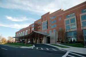 image of a brick hospital with an awning at the entrance